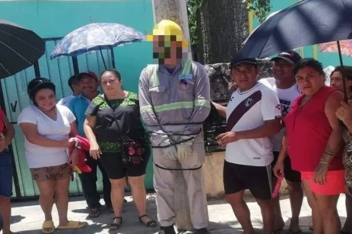 Vecinos amarran a un poste a empleado de la CFE luego de estar 3 días sin electricidad