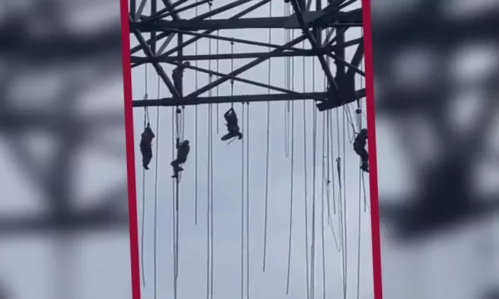 Trabajadores quedan colgados en lo alto de una construcción; uno murió